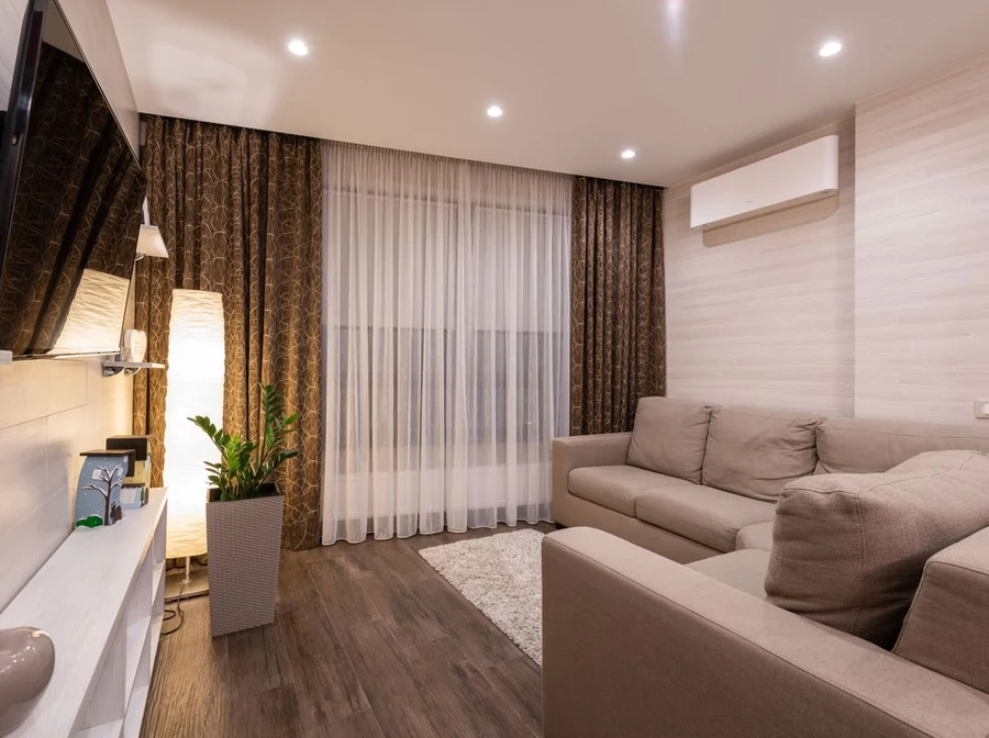 Airy sheer linen curtains and tailored drapery in a sunlit Chennai living space